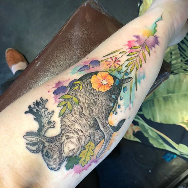 A person arm with a bunny tattoo