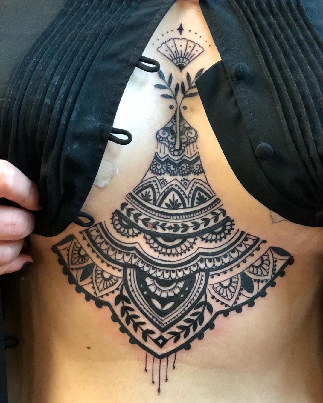 A mandala chest tattoo